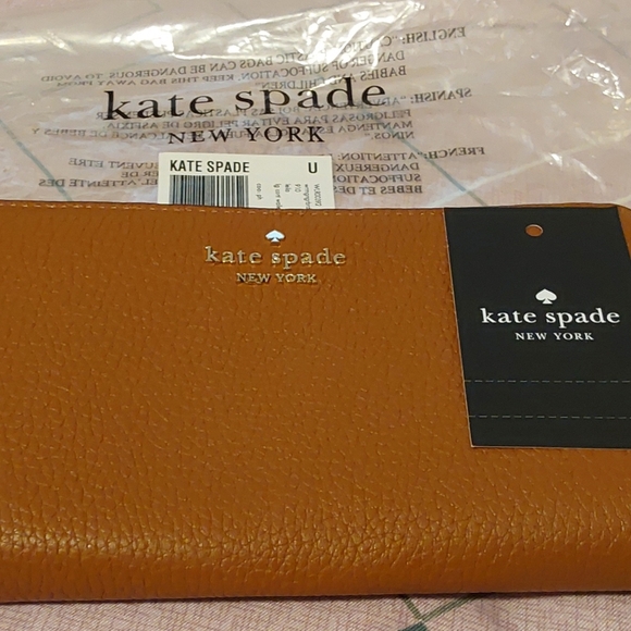 kate spade Handbags - NWT (MSRP $239) Kate Spade Tan Pebbled Leather Zip Around Wallet